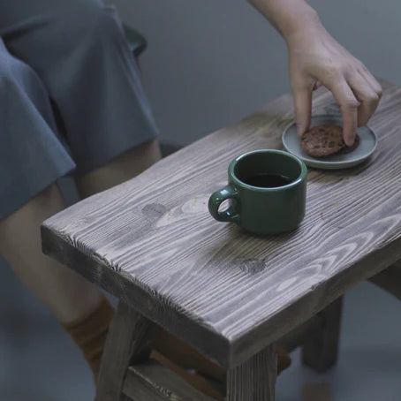 Speciality coffee beans in green mug