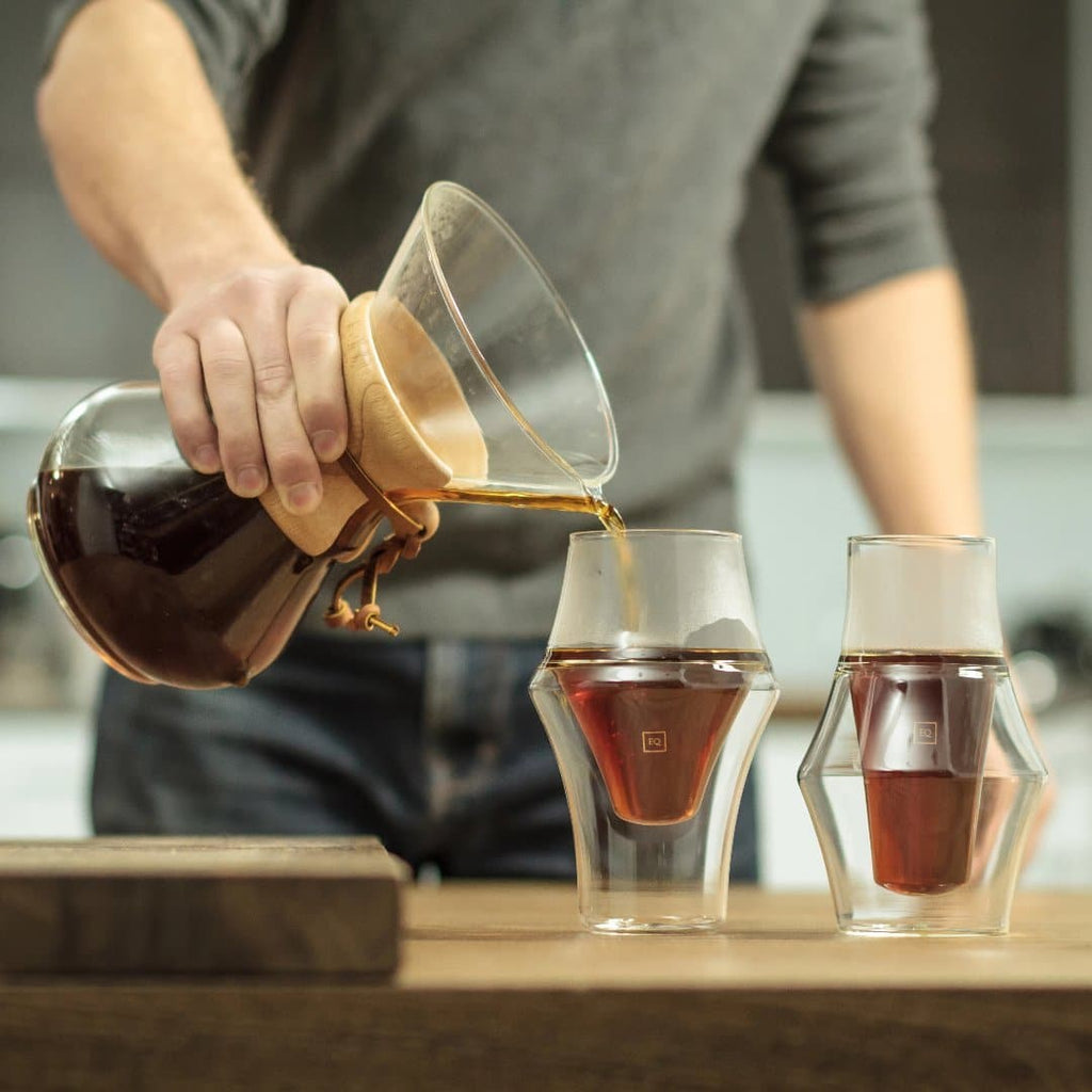 pouring coffee from decanter into kruve glass