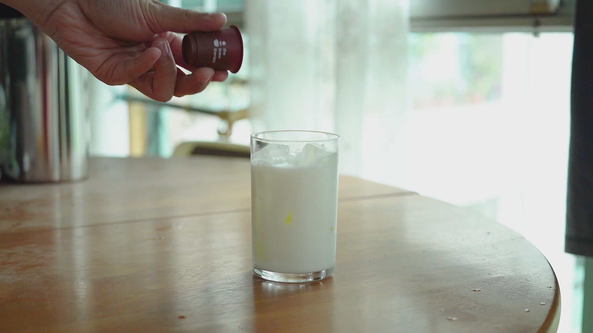 Load video: The Brew Therapy Coffee Crystals being poured into a glass of milk and ice and dissolved to make a latte